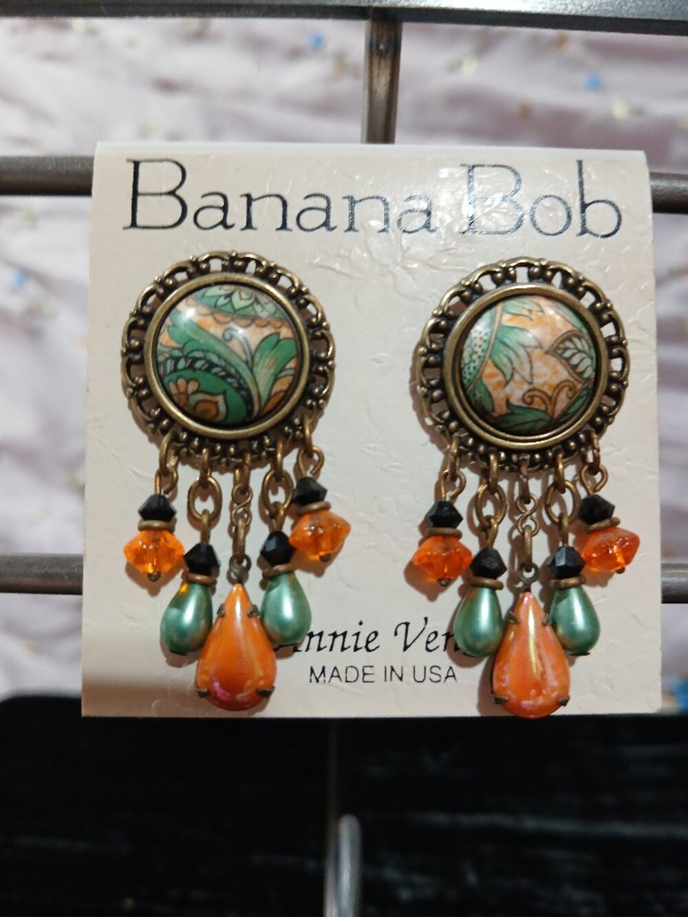 Vintage Banana Bob gold clip on earrings w/ green/orange setting & bead dangles